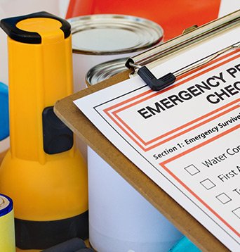 Clipboard with checklist for emergency supplies.